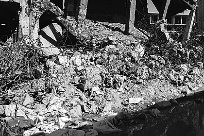 Rubble and broken buildings on a street in the Old City of Mosul